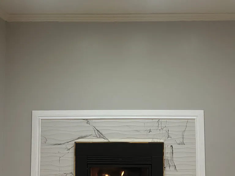 A gas fireplace in the media room/office