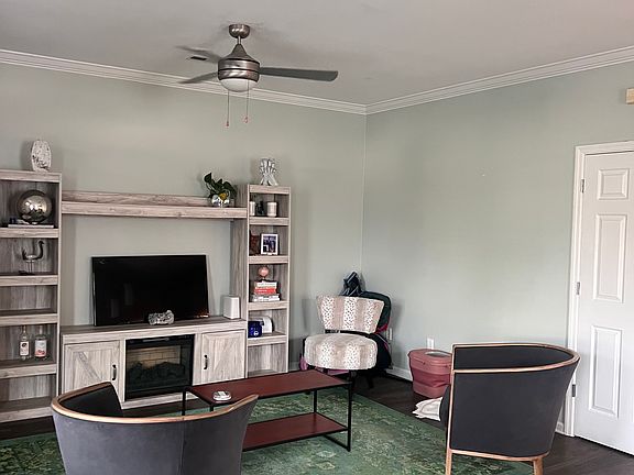 Living Area entertainment center with fireplace can stay if you're interested