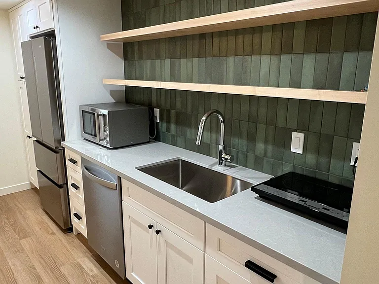 Artisan tile, soft close drawers and cabinets in the designer kitchenette