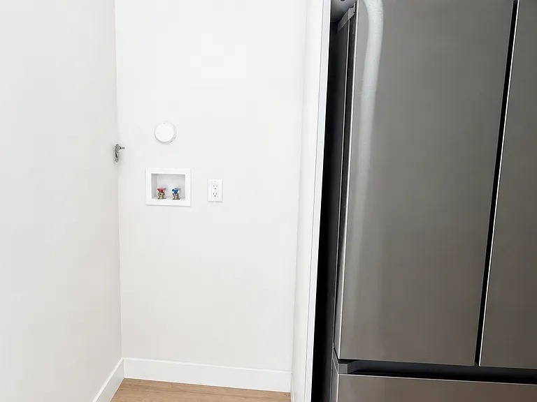 Convenient in-unit laundry hookups located off the kitchen area