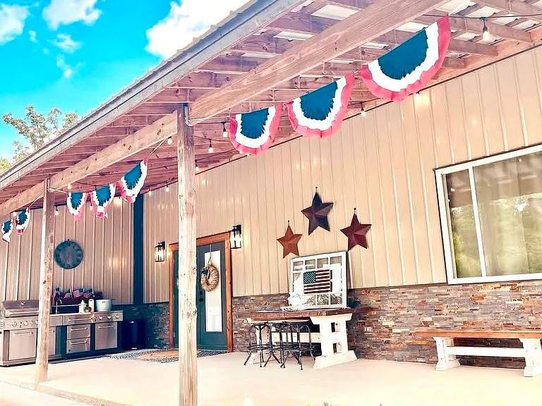 Covered porch overlooking yard/creek
