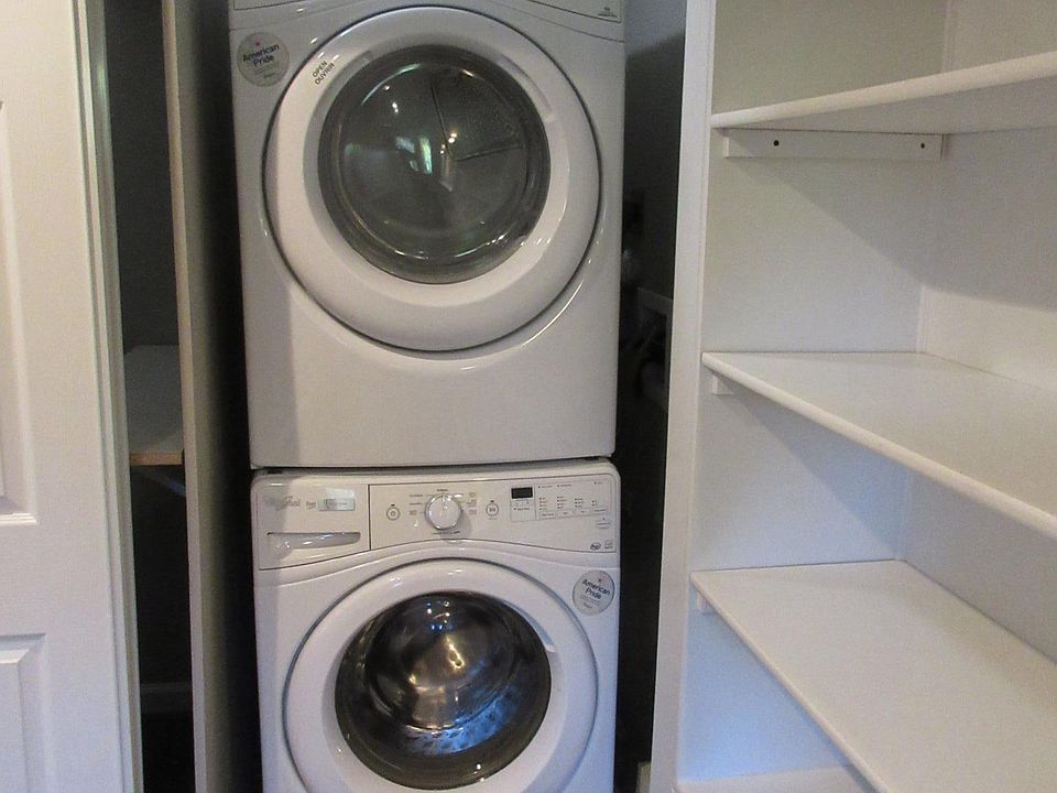Full-size Washer and Dryer, behind closet doors.