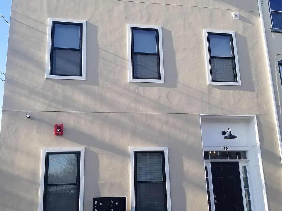 Front of apartment building with 4 apartments.