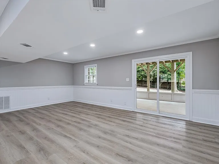 Large Basement Living Room leads to Screened-in Porch