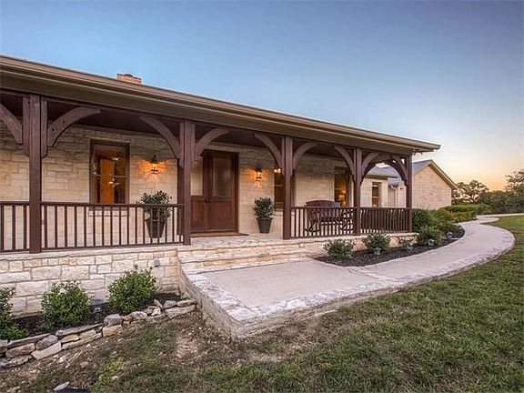 Large front porch with double front doors and wood plank ceiling