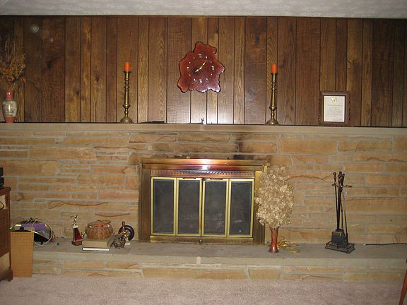 Family Rm Full Brick Hearth overlooks covered patio and large yard