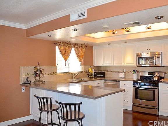 Detail of the Kitchen Tile work and Counter tops and Newer Stainless Appliances, Gas Oven