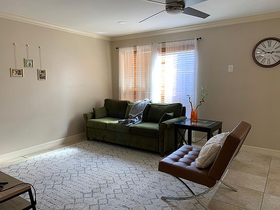 Living Room. Has modern ceiling fans and recess lighting in all major living areas.