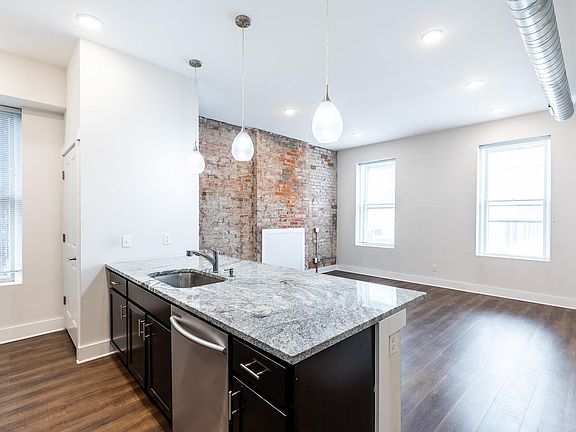 Granite counters, lots of light, wood cabinetry, exposed brick.