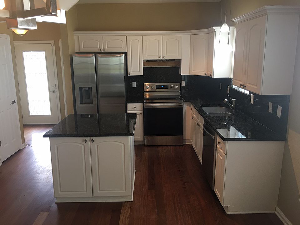 Kitchen with granite counter tops and stainless steel appliances