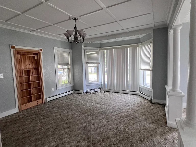 Living room with bay window (family room in the right)