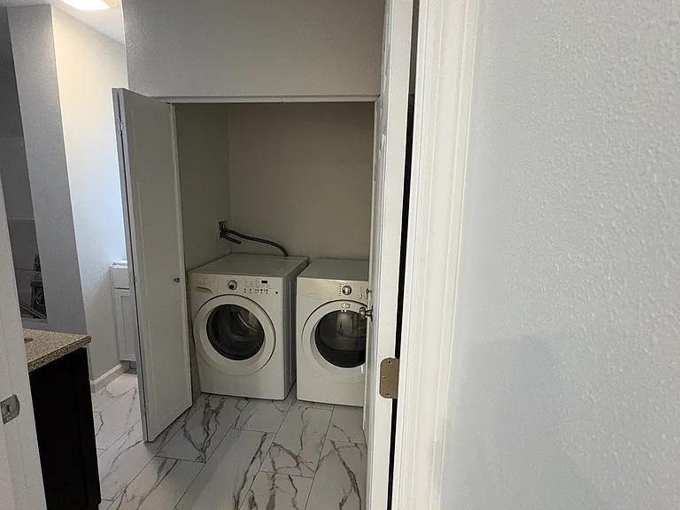 Washer/Dryer in main floor bathroom.