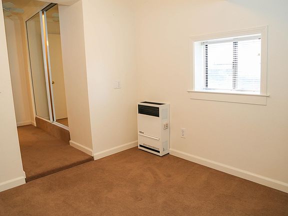 bedroom with mirrored double closet