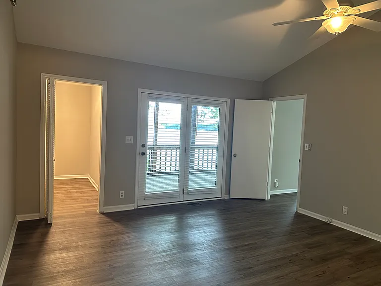 Second floor, master bedroom, looking out to deck and lake