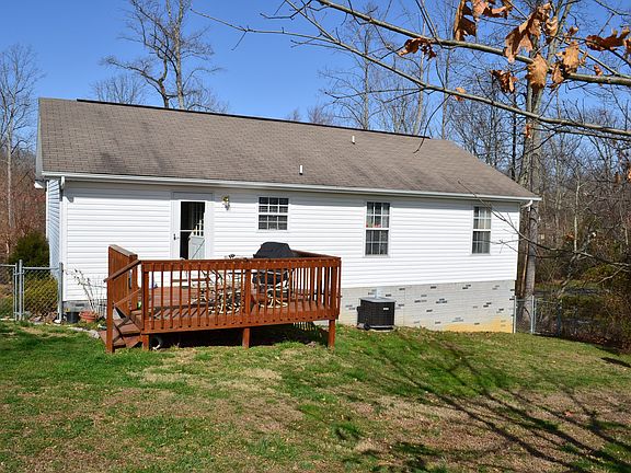 Back view, large fenced yard