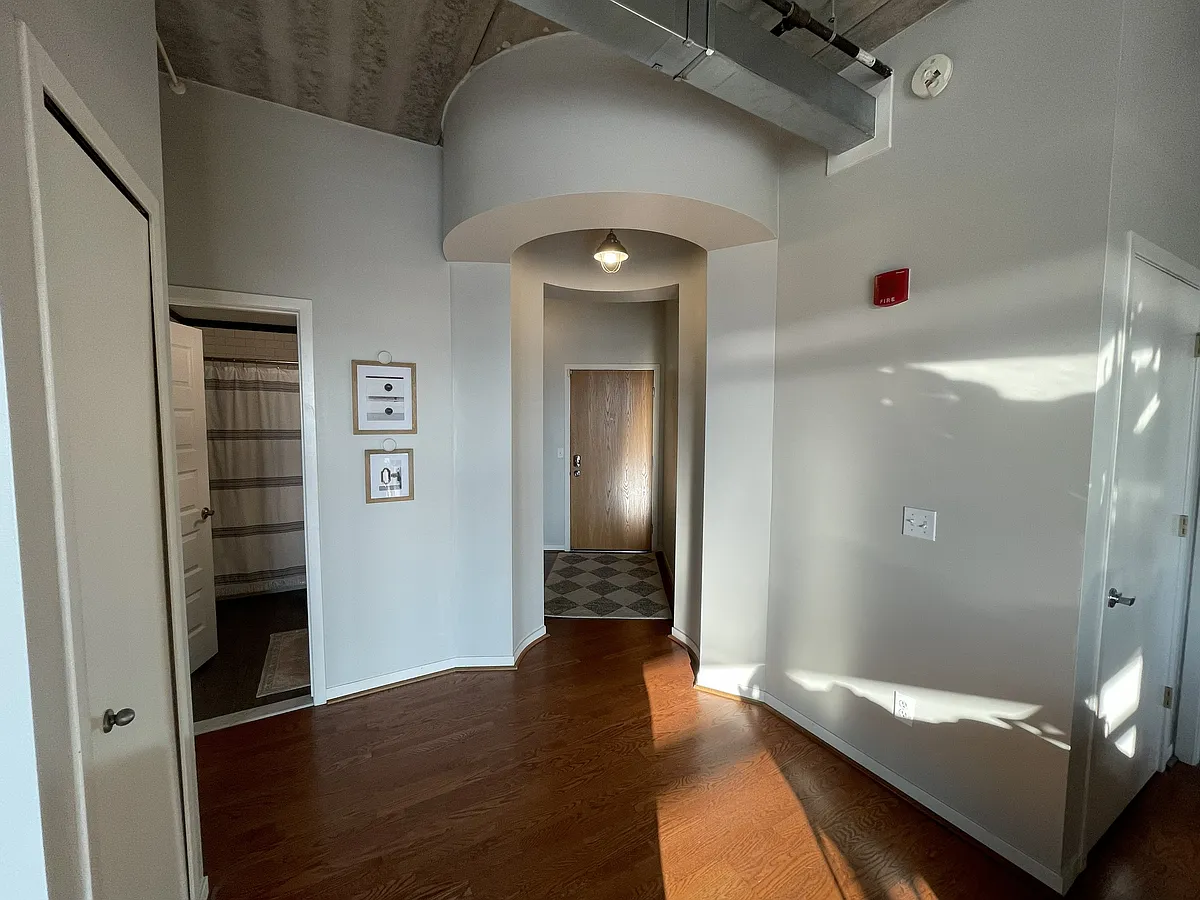 Front door entry way with spacious coat closet for extra storage. Bathroom #1 pictured, includes shower/tub combination. - 66 Winder St