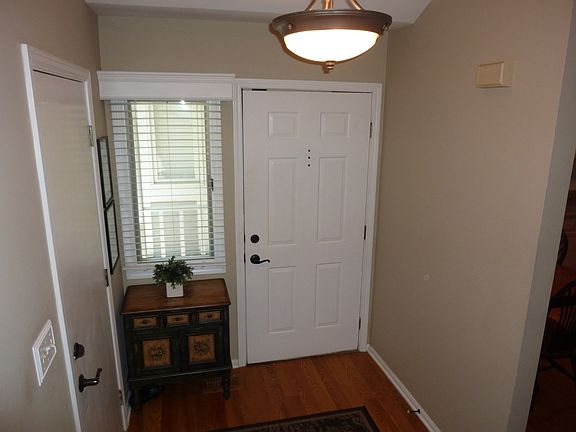 Entry with Hardwood floors and new lighting
