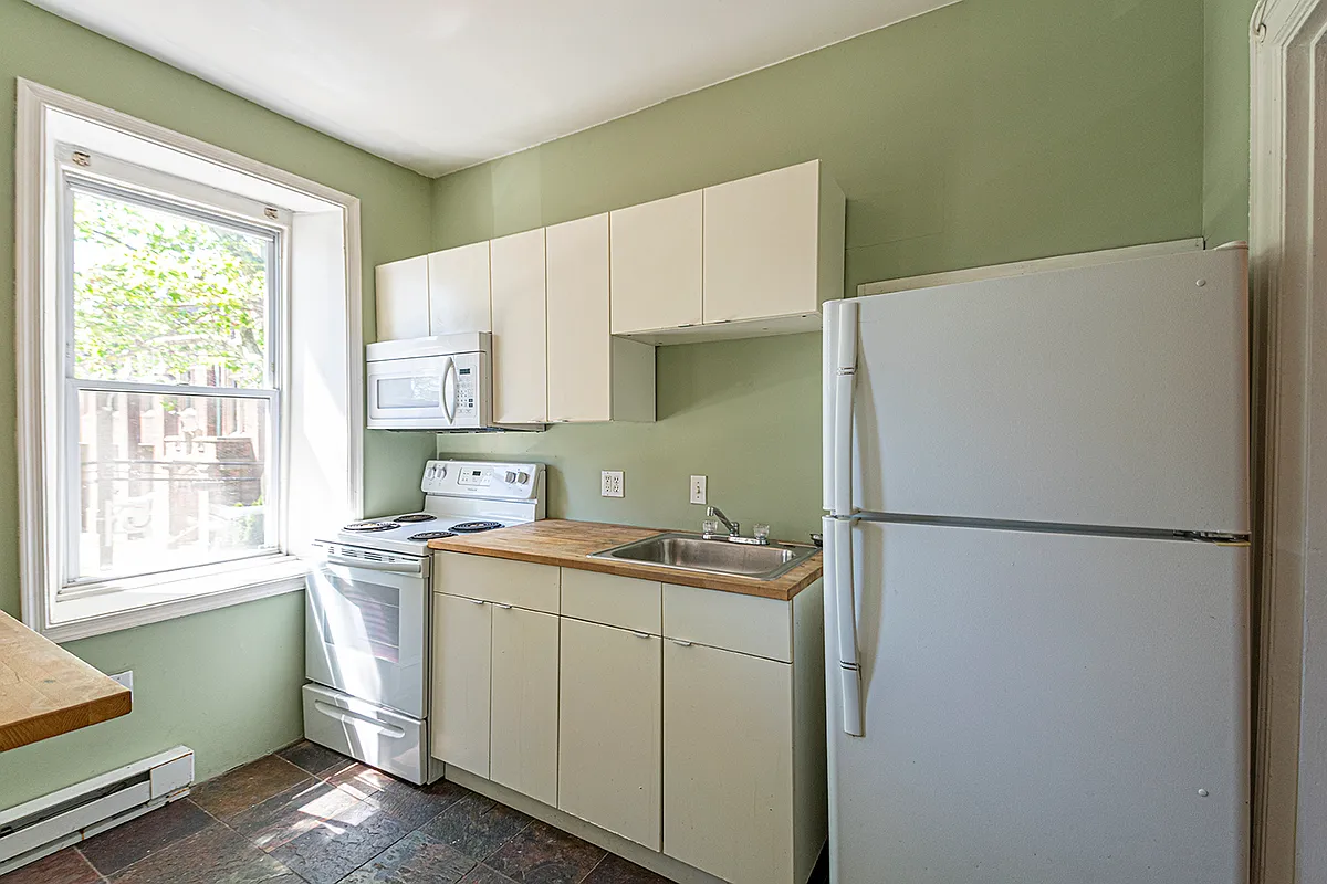 Kitchen with butcher block countertops and great light. - 5049 Spruce St #2R