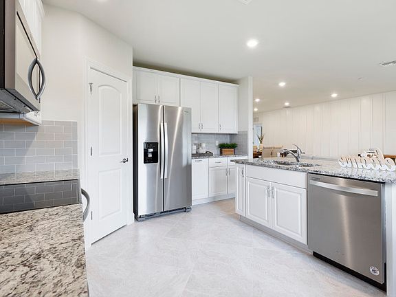 Kitchen with center island and stainless steel appliances