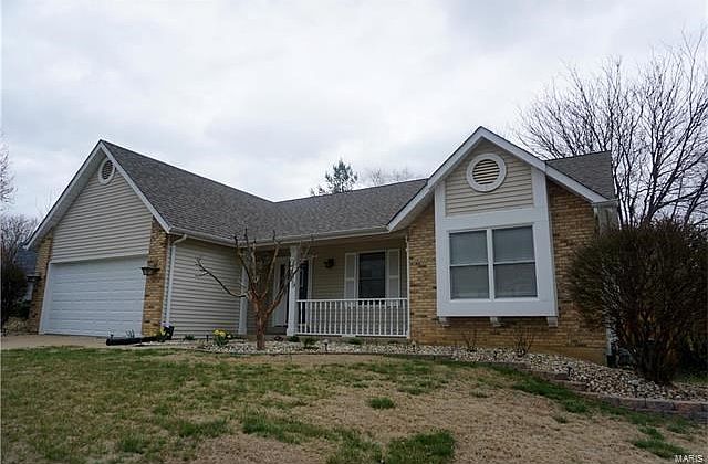 Very nicely landscaped... sprinkler system will make the grass green as soon as it's warm!