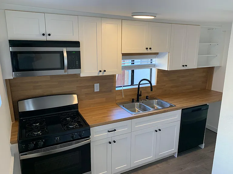 New appliances, sink, faucet, cabinets, counters, and dishwasher