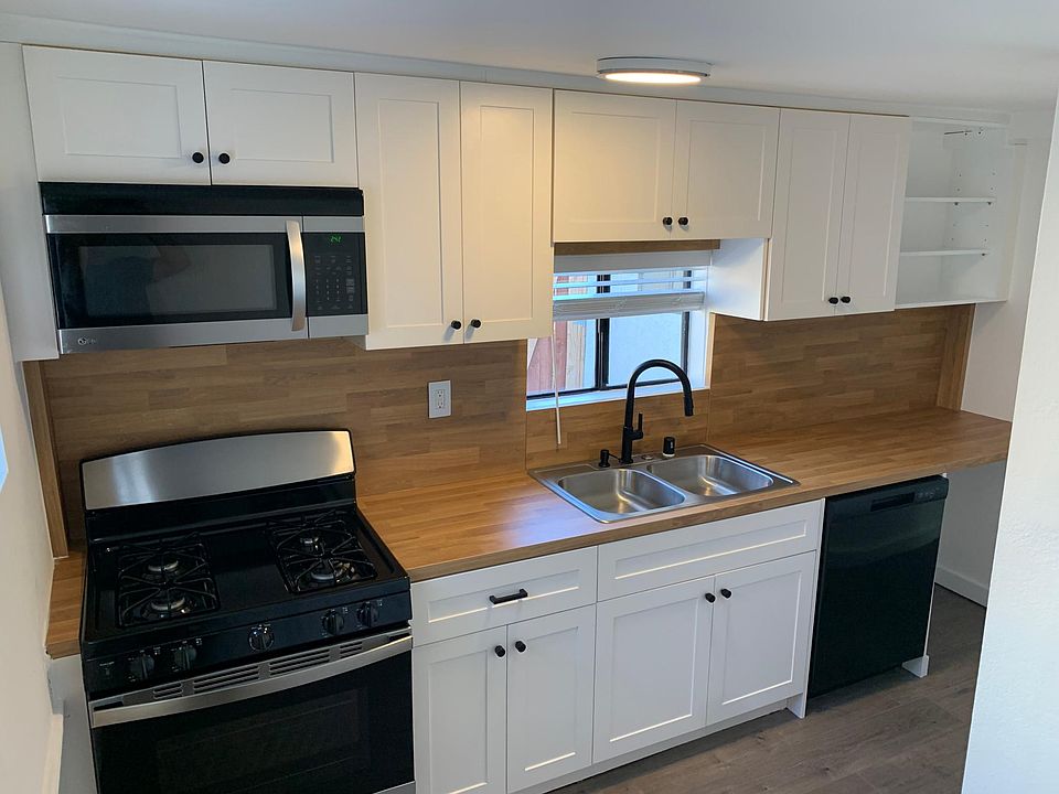 New appliances, sink, faucet, cabinets, counters, and dishwasher