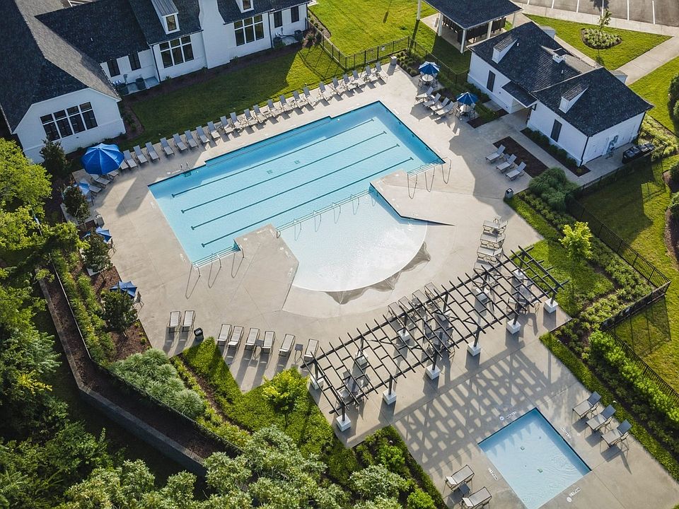 Experience refined elegance at Shelton Square s luxury clubhouse and pristine pool with lush landsca