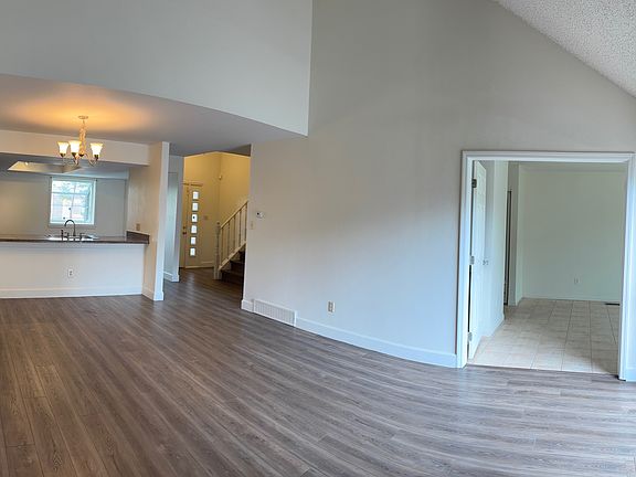 Panoramic view of living room-kitchen and main floor bedroom