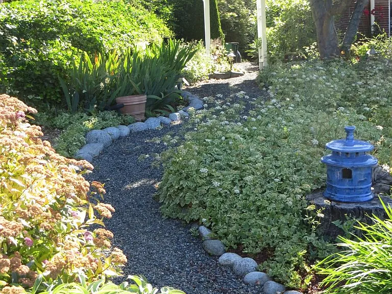 Path from on-street parking through north garden to backyard