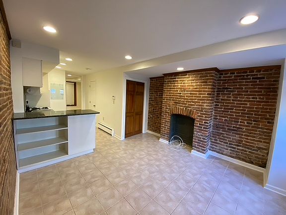 Front sitting area, built in storage and open to galley kitchen.