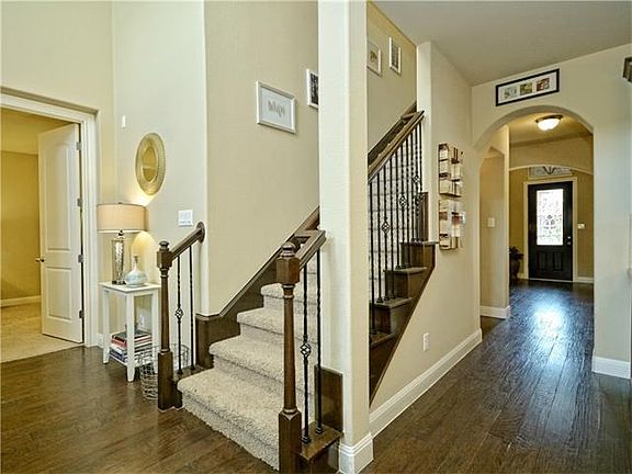 Hardwood floors throughout living areas downstairs.