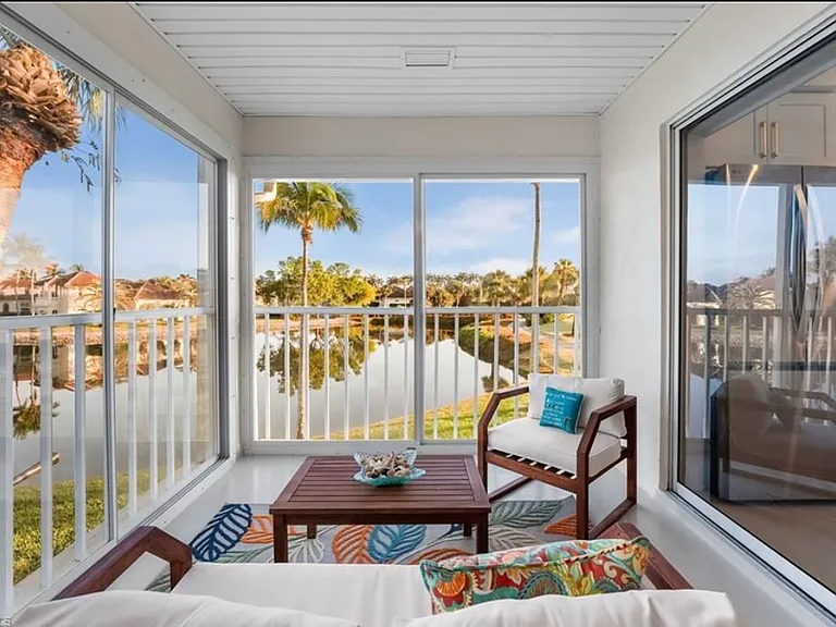 Lanai with a great view of the lake and beautiful landscaping