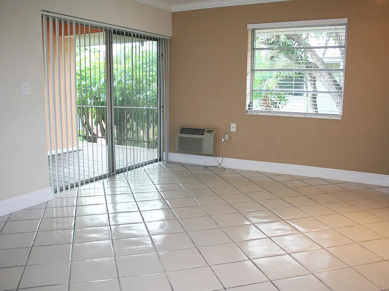 LIVING ROOM & PRIVATE PATIO | HIBISCUS MODEL | 1 BEDROOM, 1 BATH