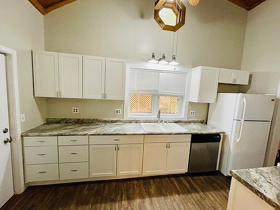 Brand new kitchen cabinets and fridge, range, over the countertop microwave and dishwasher included