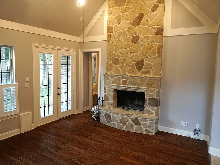 Floor to ceiling stone fireplace