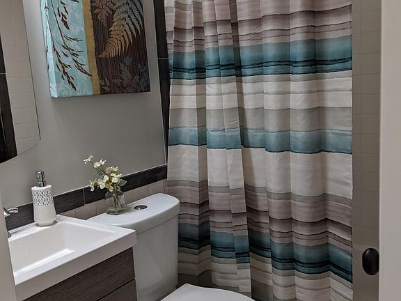 Upstairs bath with full tub.