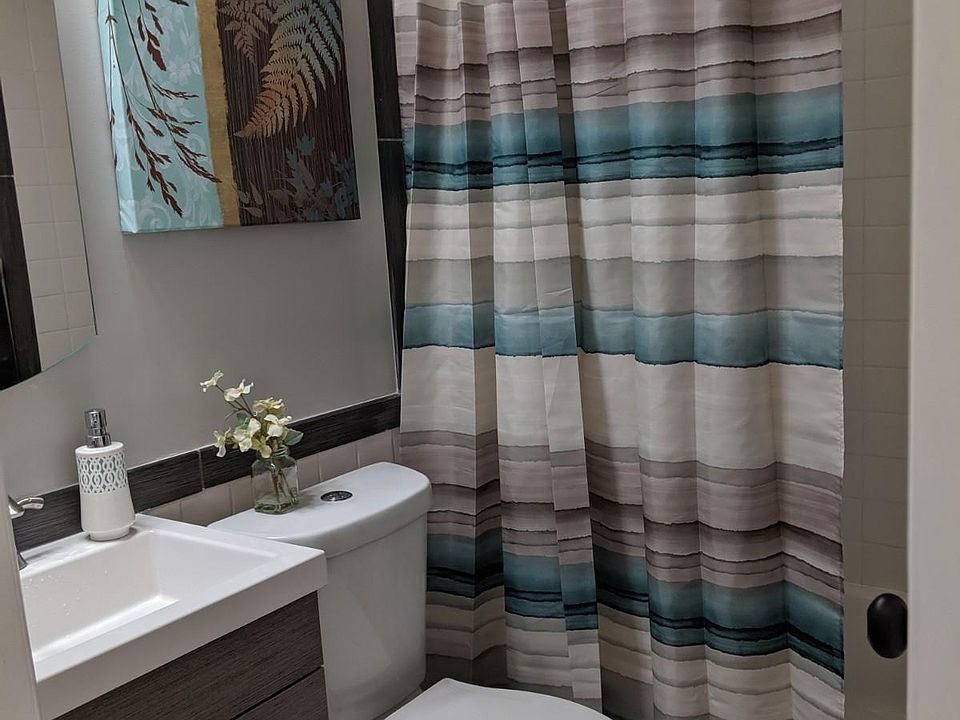 Upstairs bath with full tub.
