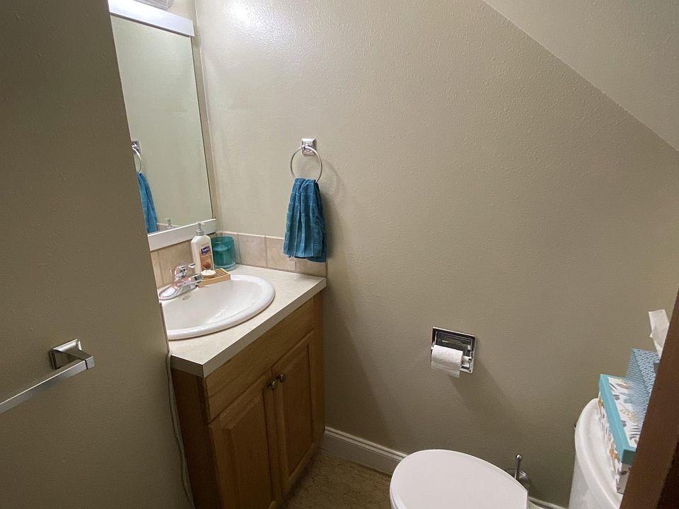 entry level half bath (tucked under the stairs)