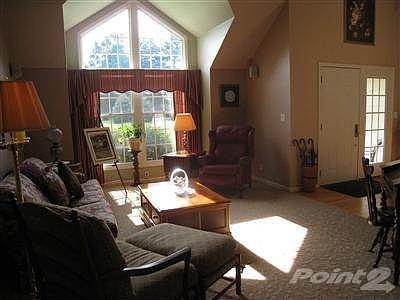 Living room with cathedral ceiling.