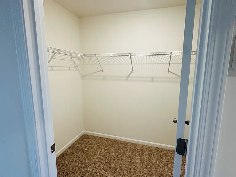 One of 2 master suite closets.
