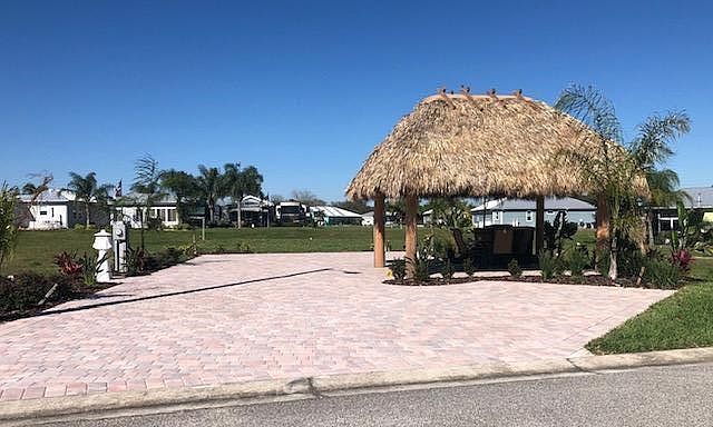 Large RV lot can accommodate 45 FT with 30/50AMP service water and sewer.