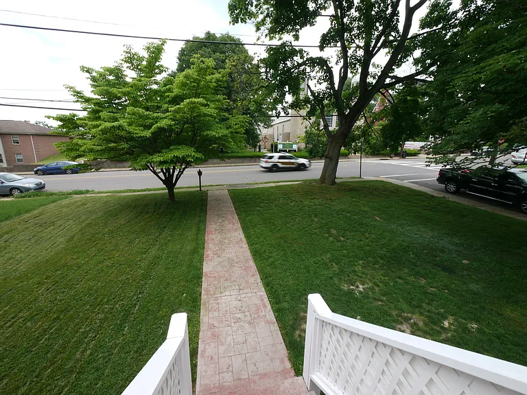 View from patio onto California Avenue. Mailbox. Parking.