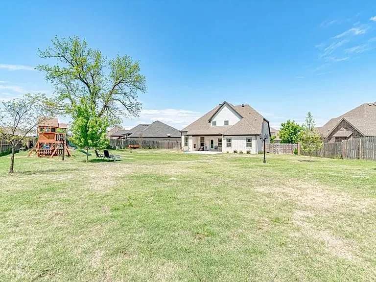 Backyard, now with two sheds for ample storage and a fire pit area