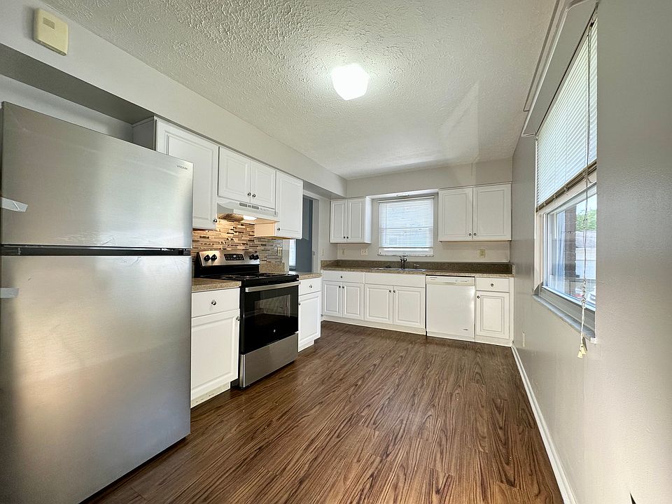 Updated and freshly painted kitchen with brand new fridge.