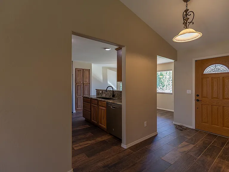 view of entry, into kitchen and dining room from living room