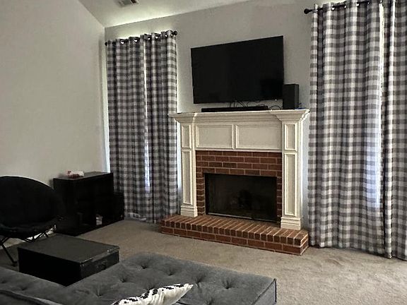 Cozy living room with soaring vaulted ceiling