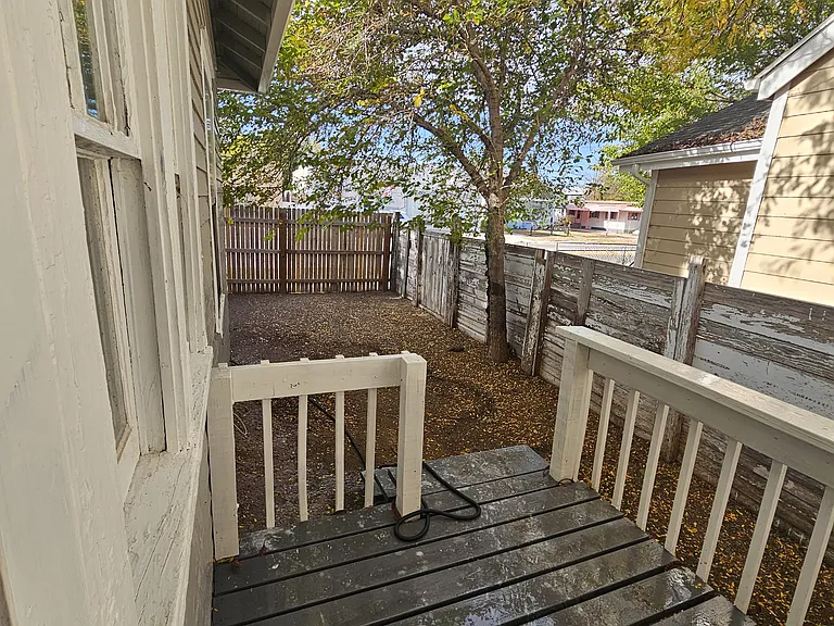 Private fenced Back Yard 23' x 7' with porch 8' x 6'