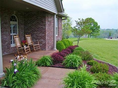 What a beautiful place to enjoy a morning cup of coffee or tea or beverage of your choice! Professional landscape frames the entry of this wonderful home! Beautiful Architecture and attention to detail in this entry truly make this home inviting!