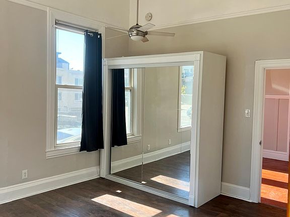 Bedroom 1 on main floor. Large windows with natural light and separate entrance.