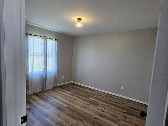 Bedroom with newlighting new flooring and new wall's